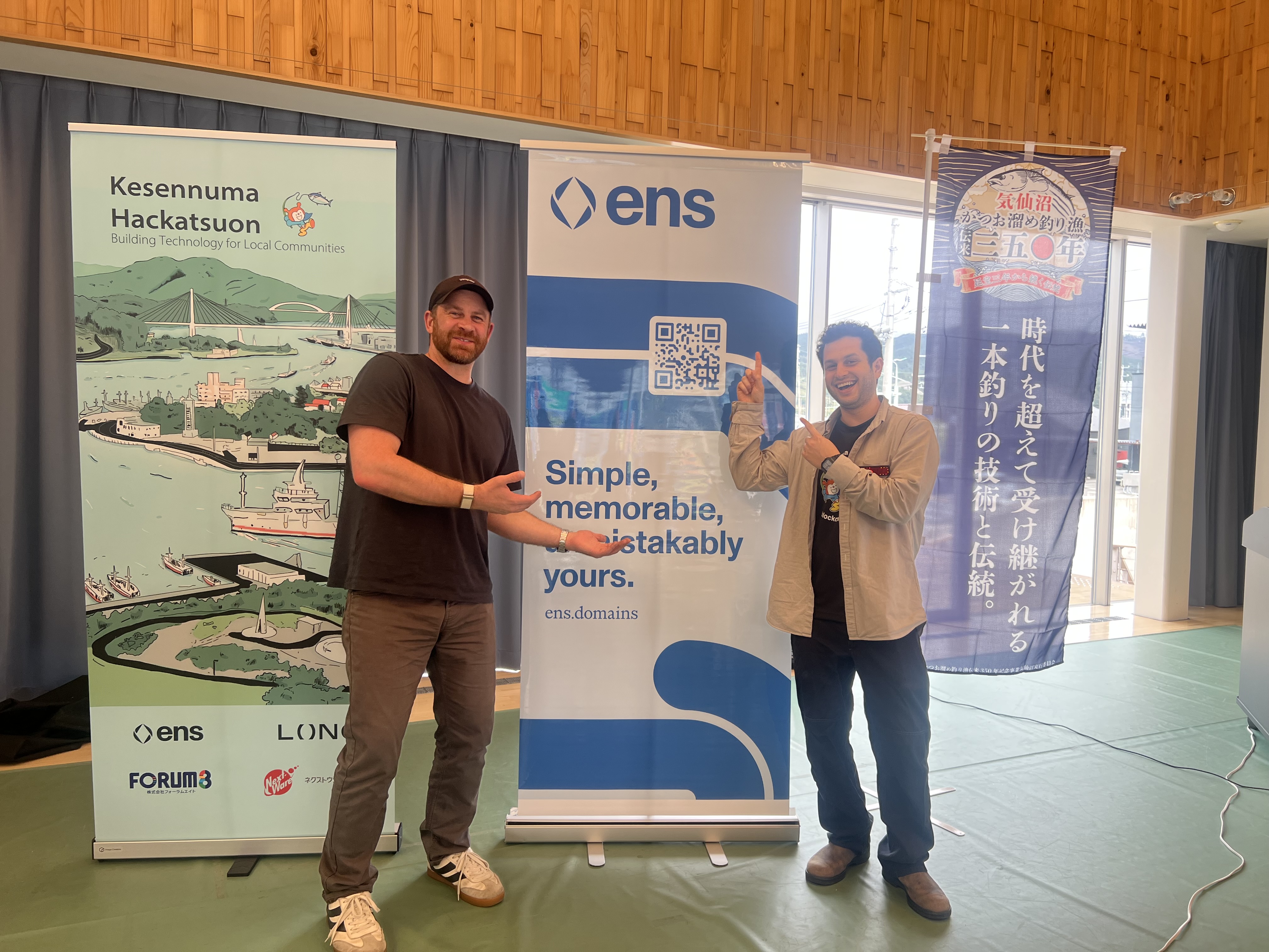 Organizers posing with event banners